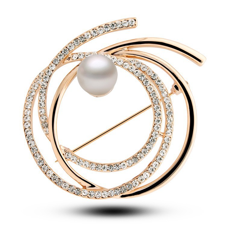 Elegantná zlatá brošňa v tvare kruhov s bielou perlou